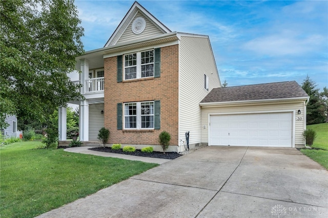30 Salem Dr, Springboro, OH 45066 - view of front facade with driveway, a front yard, an attached garage, a balcony, and brick siding