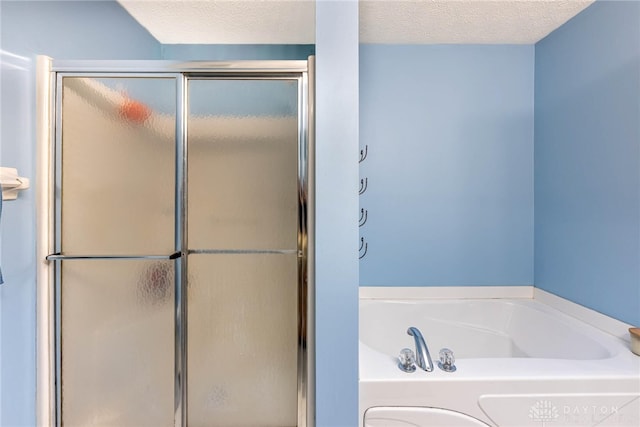 30 Salem Dr, Springboro, OH 45066 - bathroom featuring a shower stall, a bath, and a textured ceiling