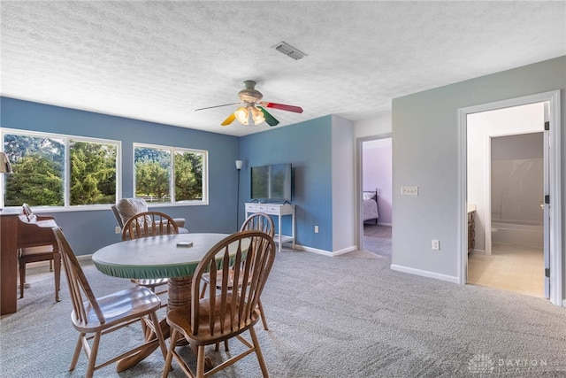 30 Salem Dr, Springboro, OH 45066 - carpeted dining room with a ceiling fan and a textured ceiling