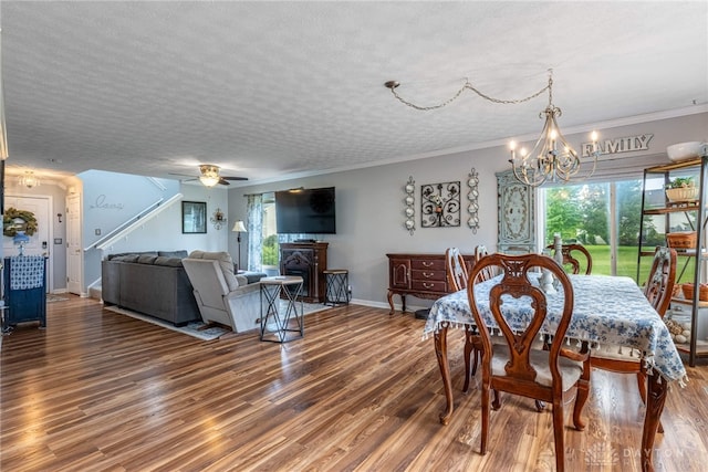 30 Salem Dr, Springboro, OH 45066 - dining space featuring a chandelier, wood finished floors, a textured ceiling, stairs, and ornamental molding