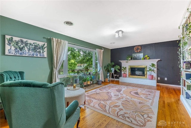 3105 Shadow Hill Rd, Middletown, OH 45042 - living area featuring wood finished floors and a glass covered fireplace