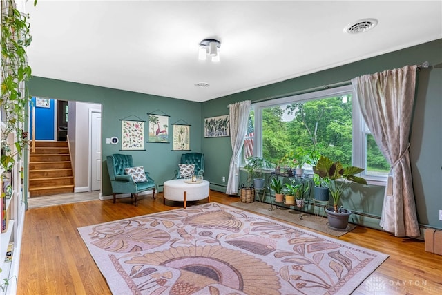 3105 Shadow Hill Rd, Middletown, OH 45042 - living area featuring wood finished floors, stairway, and baseboard heating