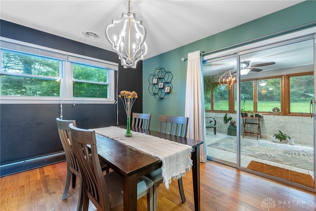 3105 Shadow Hill Rd, Middletown, OH 45042 - dining space with a chandelier, wood finished floors, and ceiling fan