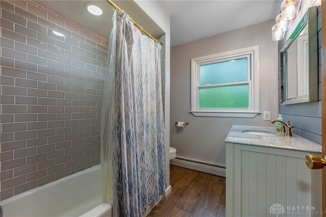 3105 Shadow Hill Rd, Middletown, OH 45042 - bathroom featuring a baseboard heating unit, wood finished floors, vanity, and shower / bath combo
