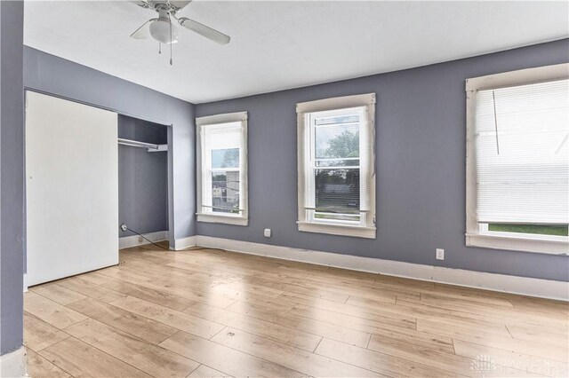 119 Wilson St, Hamilton, OH 45011 - unfurnished bedroom with wood finished floors, a ceiling fan, and a closet