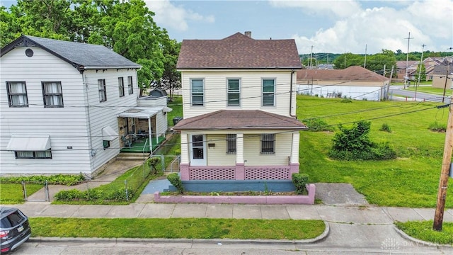 119 Wilson St, Hamilton, OH 45011 - view of front of house with a chimney, covered porch, and roof with shingles