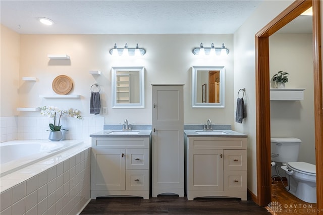 2610 Yorktown Ct, Beavercreek, OH 45434 - full bath with wood finished floors, two vanities, and a bath