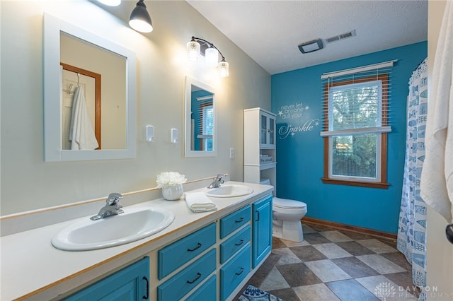 2610 Yorktown Ct, Beavercreek, OH 45434 - full bathroom featuring double vanity and a textured ceiling