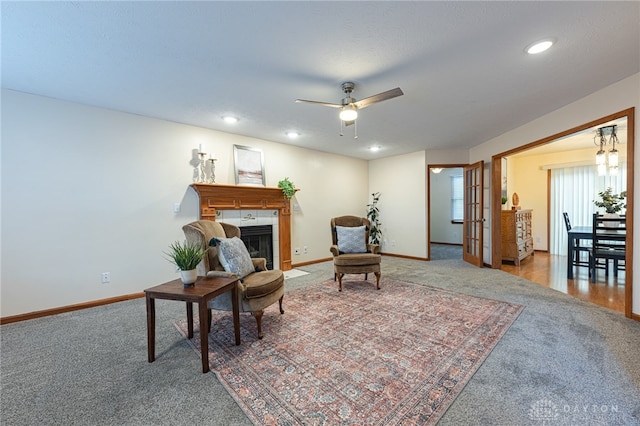 2610 Yorktown Ct, Beavercreek, OH 45434 - sitting room featuring carpet flooring, a ceiling fan, a fireplace, and recessed lighting