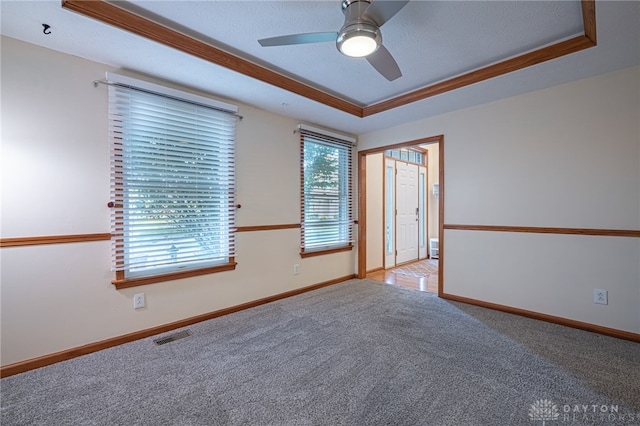 2610 Yorktown Ct, Beavercreek, OH 45434 - carpeted empty room with a raised ceiling, a ceiling fan, and a textured ceiling