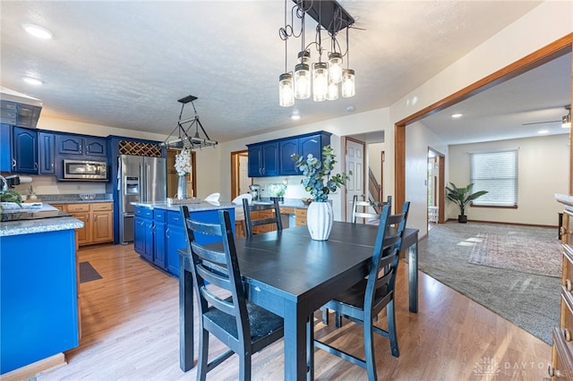 2610 Yorktown Ct, Beavercreek, OH 45434 - dining room with light wood finished floors, a chandelier, and recessed lighting