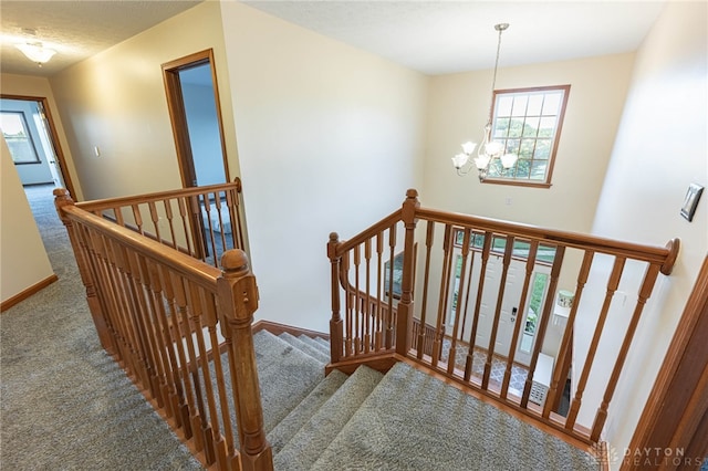 2610 Yorktown Ct, Beavercreek, OH 45434 - stairs with carpet, healthy amount of natural light, and a chandelier