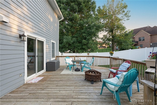 2610 Yorktown Ct, Beavercreek, OH 45434 - wooden deck featuring an outdoor fire pit, a fenced backyard, and outdoor dining area