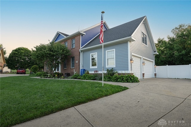 2610 Yorktown Ct, Beavercreek, OH 45434 - view of front of house featuring concrete driveway, a garage, and brick siding