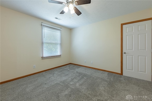 2610 Yorktown Ct, Beavercreek, OH 45434 - empty room with carpet flooring, ceiling fan, and a textured ceiling