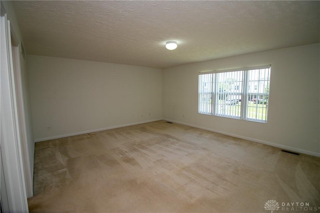 2710 Zoellners Way, Fairfield Twp, OH 45011 - spare room featuring light carpet and a textured ceiling