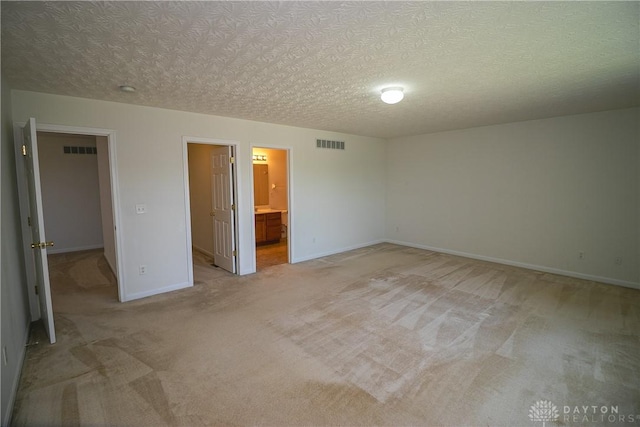 2710 Zoellners Way, Fairfield Twp, OH 45011 - unfurnished bedroom featuring light carpet and a textured ceiling