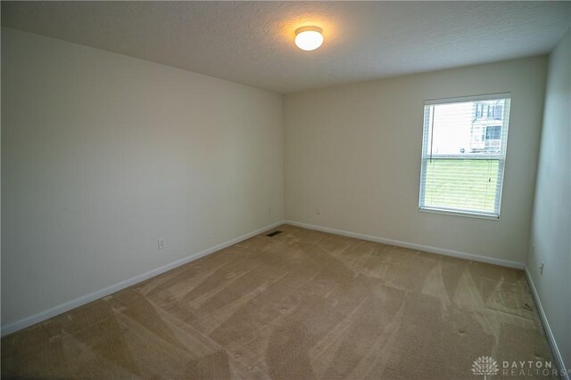 2710 Zoellners Way, Fairfield Twp, OH 45011 - unfurnished room with light colored carpet and a textured ceiling