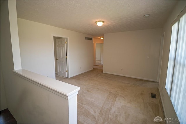 2710 Zoellners Way, Fairfield Twp, OH 45011 - empty room featuring light carpet and a textured ceiling