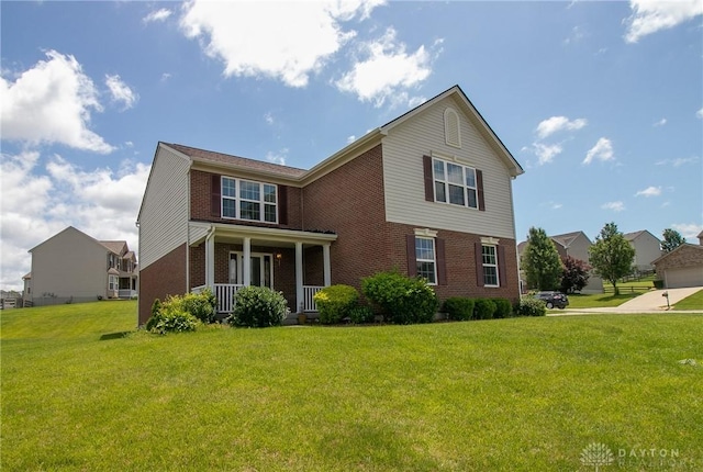 2710 Zoellners Way, Fairfield Twp, OH 45011 - view of front of house featuring brick siding, a porch, and a front yard