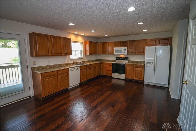 2710 Zoellners Way, Fairfield Twp, OH 45011 - kitchen featuring white appliances, brown cabinetry, dark wood-type flooring, and recessed lighting