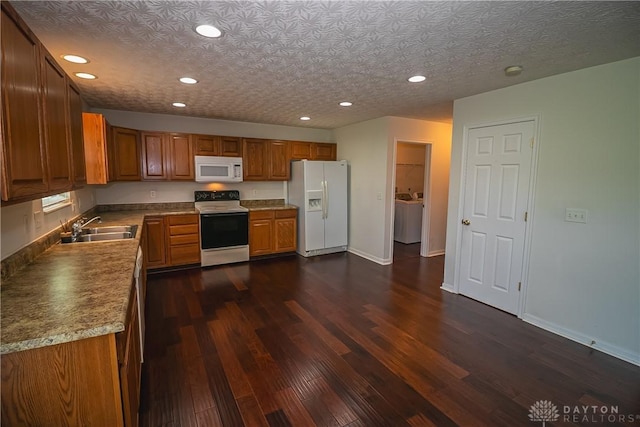 2710 Zoellners Way, Fairfield Twp, OH 45011 - kitchen with white appliances, brown cabinetry, recessed lighting, dark wood-style flooring, and separate washer and dryer
