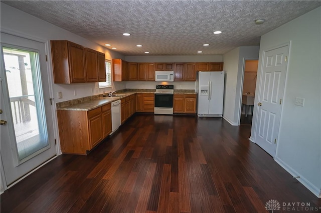 2710 Zoellners Way, Fairfield Twp, OH 45011 - kitchen featuring white appliances, dark wood-style floors, brown cabinetry, and recessed lighting