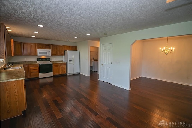2710 Zoellners Way, Fairfield Twp, OH 45011 - kitchen with white appliances, brown cabinetry, recessed lighting, arched walkways, and dark wood finished floors