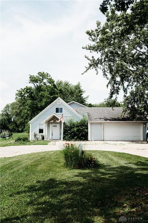 916 Wilson Rd, Troy, OH 45373 - view of front of house with a front lawn, a garage, and driveway