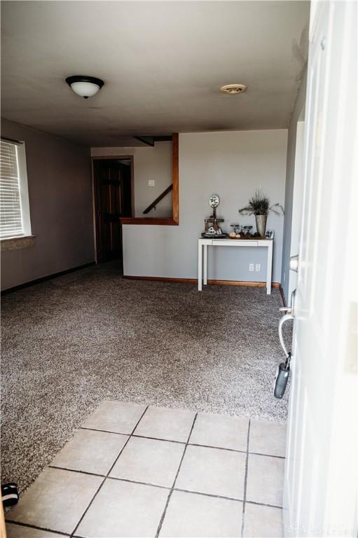 916 Wilson Rd, Troy, OH 45373 - spare room featuring carpet flooring and baseboards