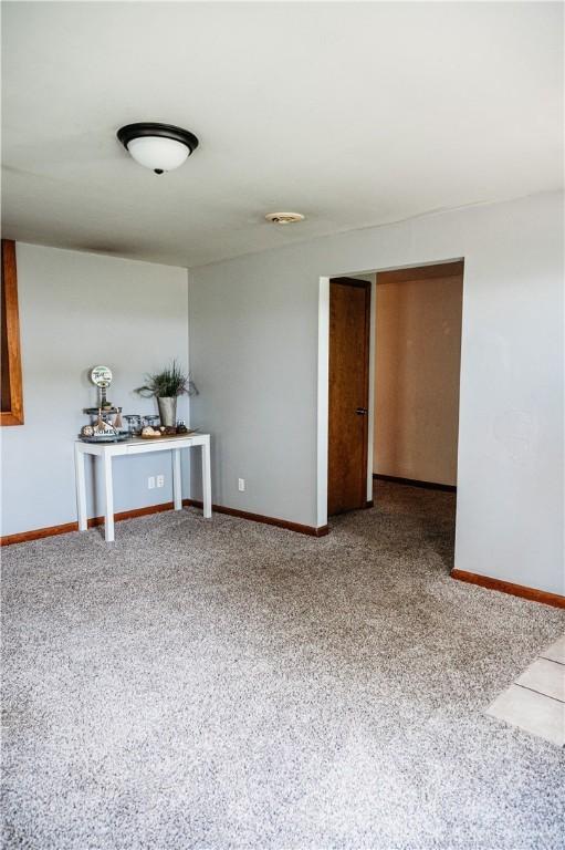 916 Wilson Rd, Troy, OH 45373 - carpeted empty room with baseboards