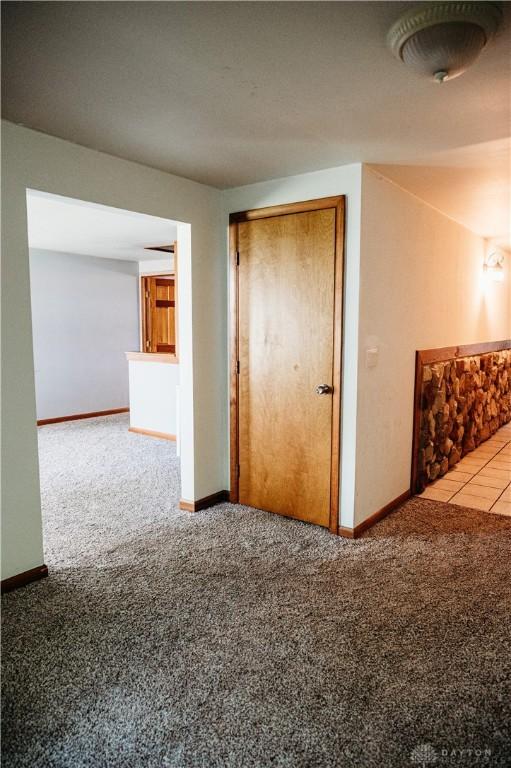916 Wilson Rd, Troy, OH 45373 - carpeted empty room with baseboards