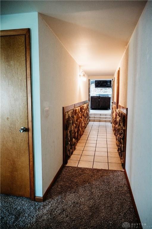 916 Wilson Rd, Troy, OH 45373 - hallway with light colored carpet and light tile patterned floors