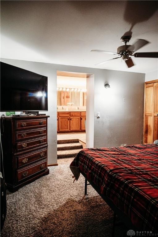 916 Wilson Rd, Troy, OH 45373 - bedroom with carpet, connected bathroom, and ceiling fan