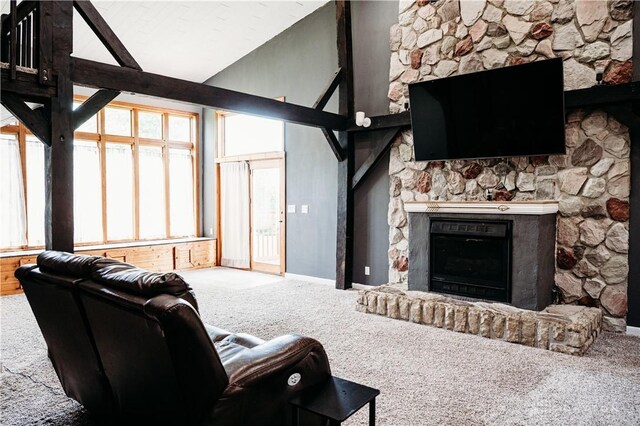 916 Wilson Rd, Troy, OH 45373 - living area featuring carpet floors, a fireplace, and high vaulted ceiling