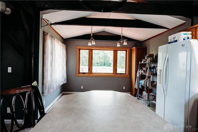 916 Wilson Rd, Troy, OH 45373 - dining room with lofted ceiling and baseboards