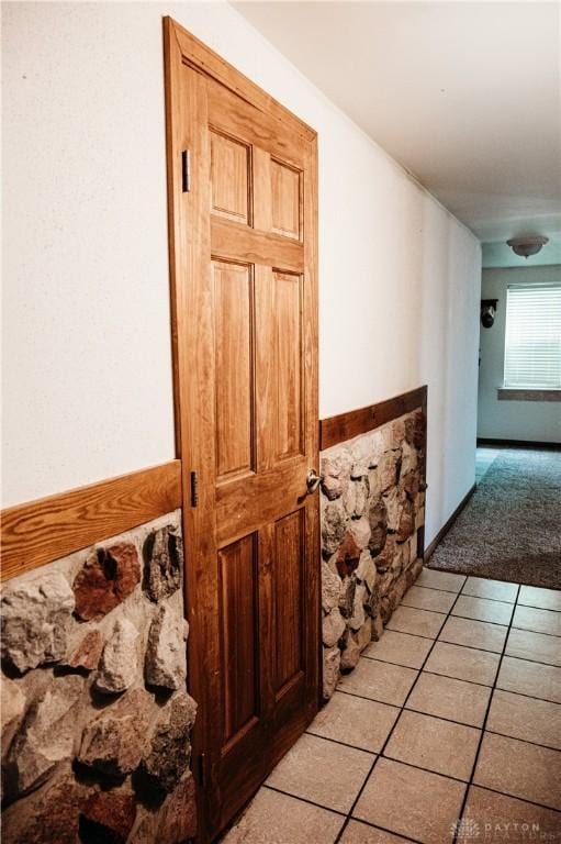 916 Wilson Rd, Troy, OH 45373 - hall with light tile patterned floors and light carpet