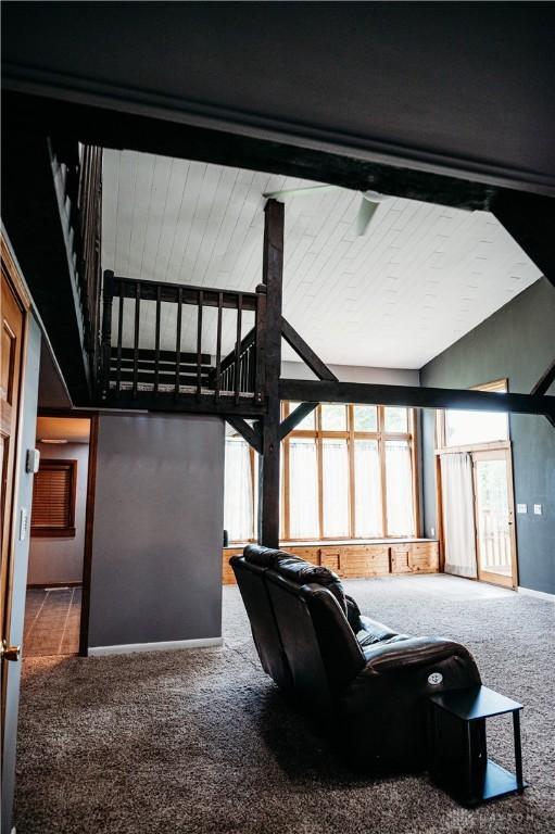 916 Wilson Rd, Troy, OH 45373 - living room with carpet flooring and high vaulted ceiling