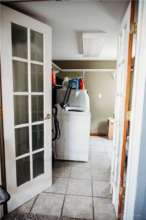 916 Wilson Rd, Troy, OH 45373 - washroom with tile patterned flooring and washer and clothes dryer