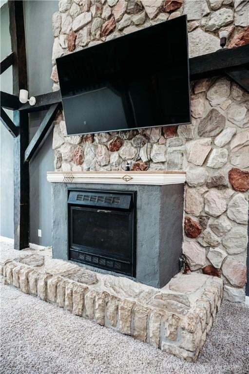 916 Wilson Rd, Troy, OH 45373 - detailed view of a fireplace with raised hearth and carpet flooring