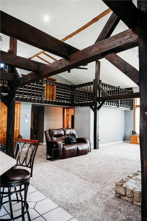 916 Wilson Rd, Troy, OH 45373 - carpeted cinema with high vaulted ceiling and beam ceiling