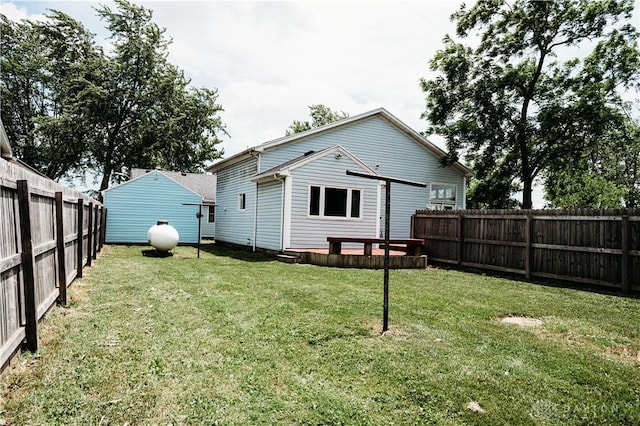 916 Wilson Rd, Troy, OH 45373 - rear view of house with a fenced backyard