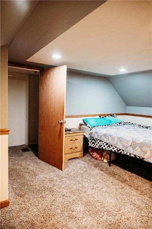 916 Wilson Rd, Troy, OH 45373 - carpeted bedroom featuring vaulted ceiling and recessed lighting