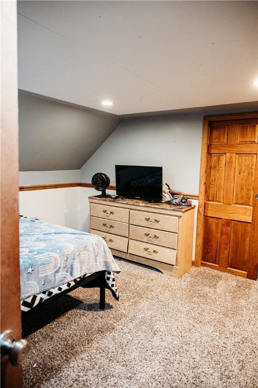 916 Wilson Rd, Troy, OH 45373 - carpeted bedroom featuring lofted ceiling