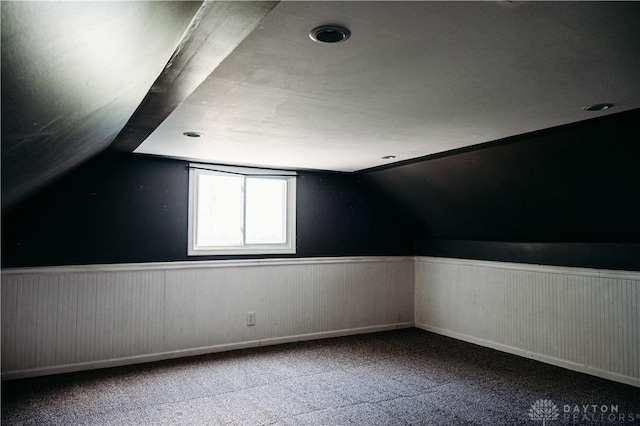 916 Wilson Rd, Troy, OH 45373 - additional living space featuring wainscoting, vaulted ceiling, and carpet floors