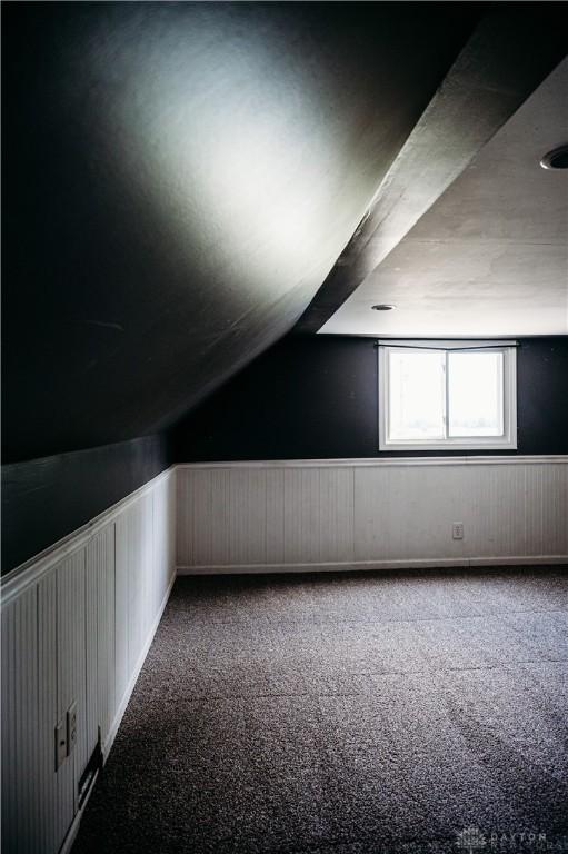 916 Wilson Rd, Troy, OH 45373 - bonus room with wainscoting, carpet flooring, and lofted ceiling