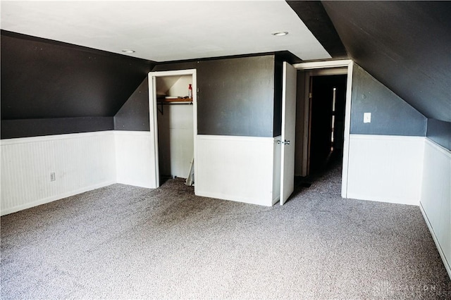 916 Wilson Rd, Troy, OH 45373 - additional living space featuring a wainscoted wall, lofted ceiling, and carpet floors
