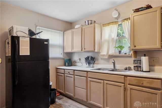 711 E 2nd St, Xenia, OH 45385 - kitchen with freestanding refrigerator, light countertops, and light wood-style floors