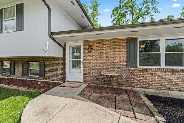 416 Bent Twig Dr, Vandalia, OH 45377 - view of exterior entry with a patio and brick siding