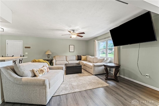 416 Bent Twig Dr, Vandalia, OH 45377 - living area with ceiling fan, dark wood-style floors, and a textured ceiling